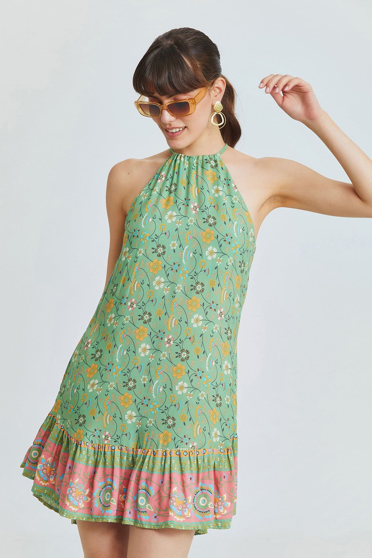 Green Mini Bohemian Dress with Halter Neckline and Patterned Ruffled Skirt