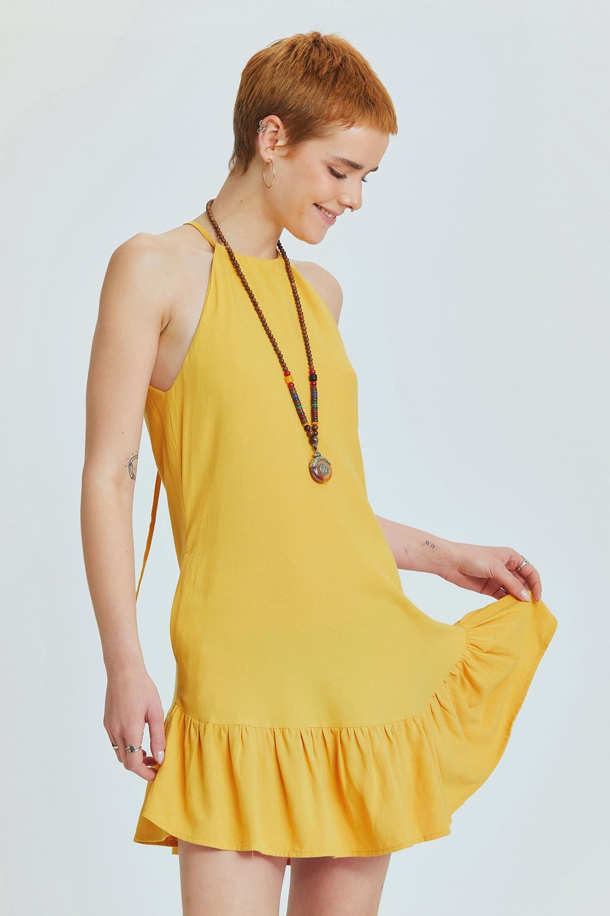 Yellow Linen Blend Mini Bohemian Dress with Halter Neckline and Ruffled Skirt